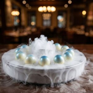 Chocolate-covered ice cream bonbons served with a dramatic dry ice fog effect.